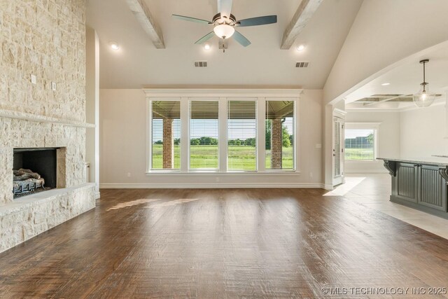 17413 S 52nd E Ave, Bixby, OK 74008 - unfurnished living room with beam ceiling, high vaulted ceiling, ceiling fan, a fireplace, and wood finished floors