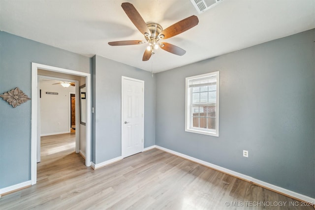 unfurnished bedroom featuring ceiling fan and light hardwood / wood-style flooring