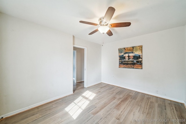 unfurnished room with ceiling fan and light hardwood / wood-style floors