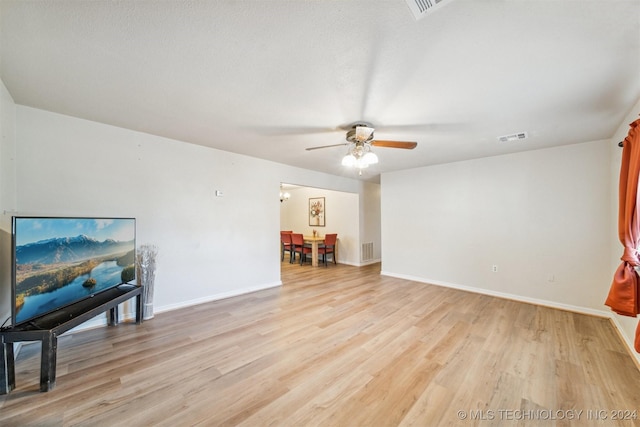 interior space featuring ceiling fan and light hardwood / wood-style flooring