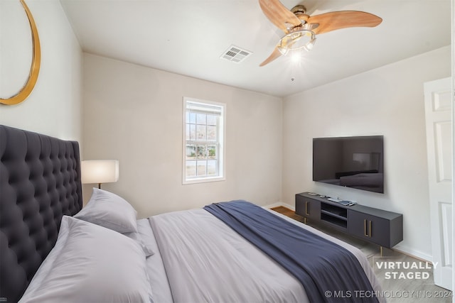 bedroom featuring ceiling fan and wood-type flooring