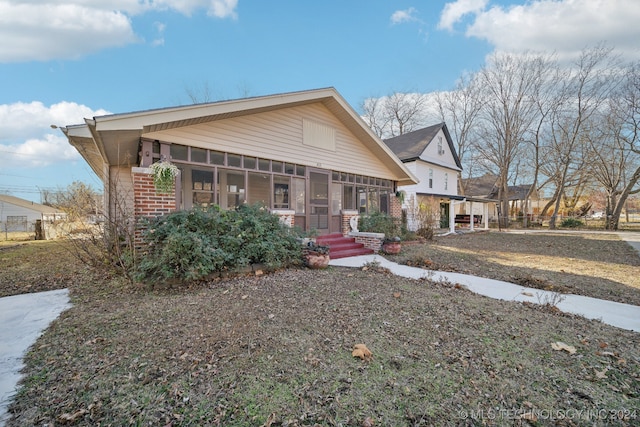 view of front of property with a sunroom