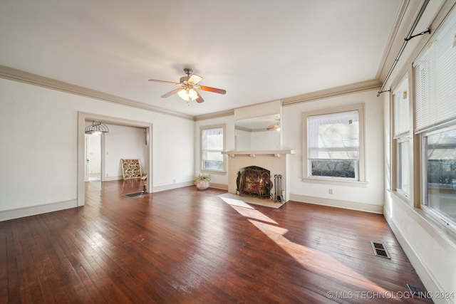 unfurnished living room with ceiling fan, dark hardwood / wood-style floors, and ornamental molding