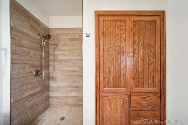 bathroom with tiled shower