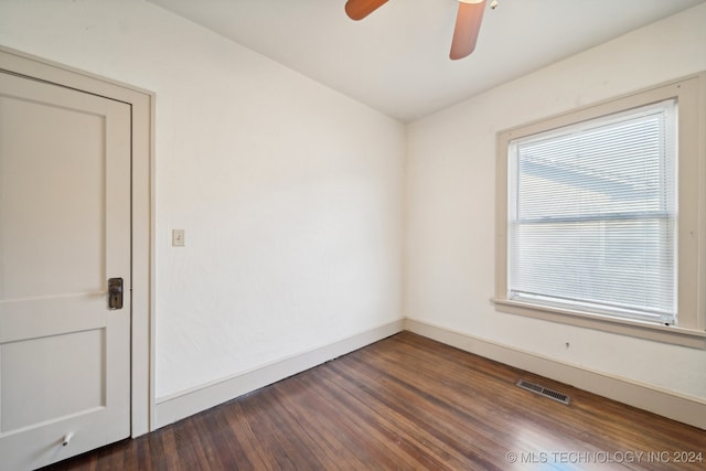 spare room featuring dark hardwood / wood-style floors and ceiling fan