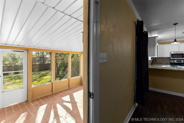 unfurnished sunroom featuring sink