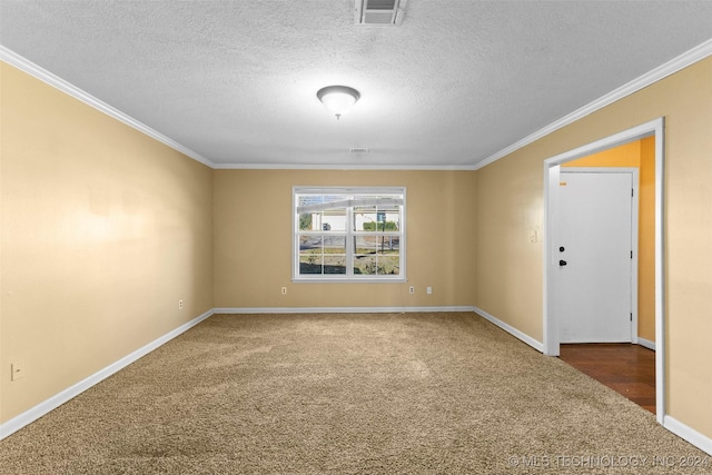 spare room featuring carpet flooring, a textured ceiling, and crown molding