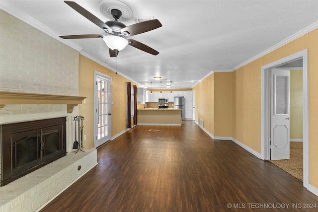 unfurnished living room with a fireplace, dark hardwood / wood-style flooring, ceiling fan, and ornamental molding