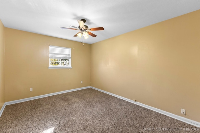 empty room with carpet flooring and ceiling fan