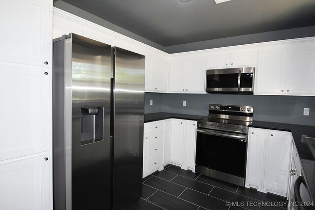 kitchen featuring white cabinets and appliances with stainless steel finishes