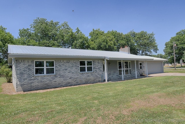 ranch-style home featuring a garage and a front yard