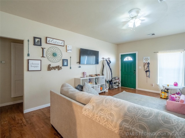 living room with hardwood / wood-style floors and ceiling fan