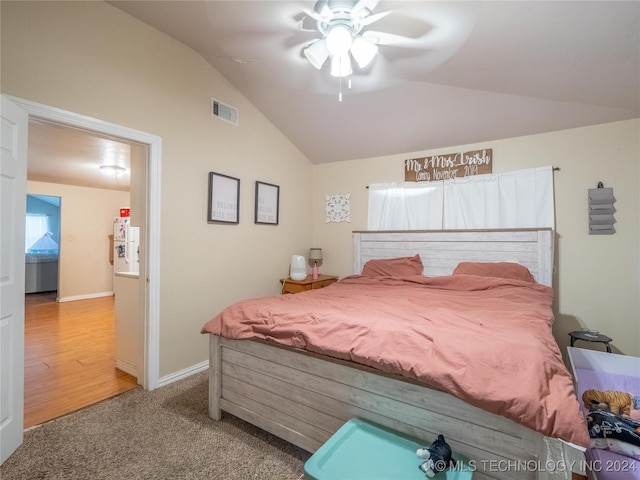 bedroom featuring ceiling fan, carpet floors, and lofted ceiling