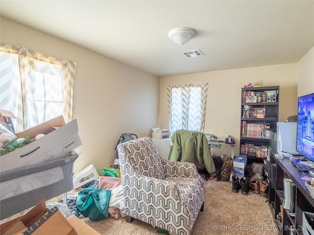 living area featuring carpet floors