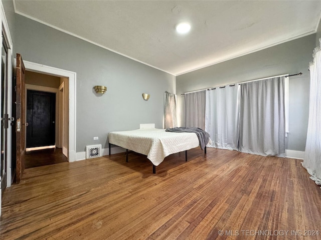 bedroom featuring hardwood / wood-style floors