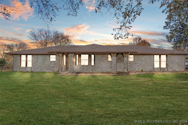 view of front of property with a lawn