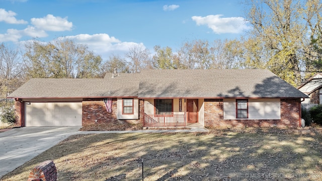 ranch-style home with a porch, a garage, and a front yard