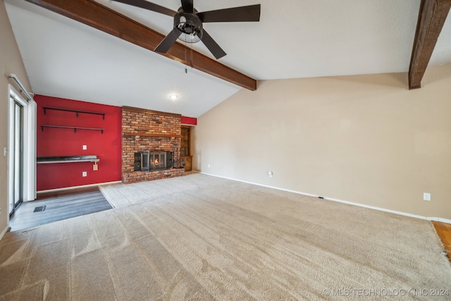 unfurnished living room featuring ceiling fan, carpet floors, lofted ceiling with beams, and a brick fireplace