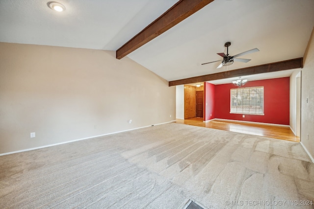 unfurnished living room with ceiling fan with notable chandelier, light carpet, and vaulted ceiling with beams