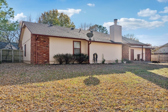 back of house with a yard