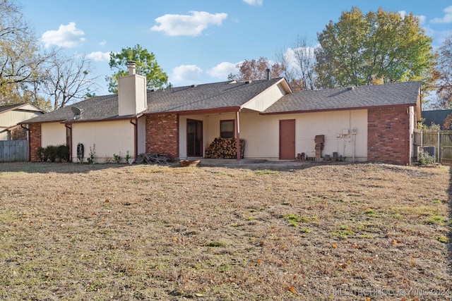 back of house with a yard