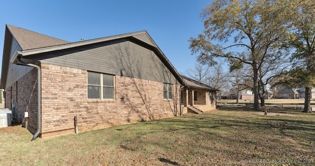 view of home's exterior featuring a lawn