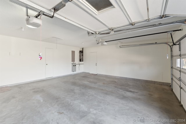 garage with electric panel and a garage door opener