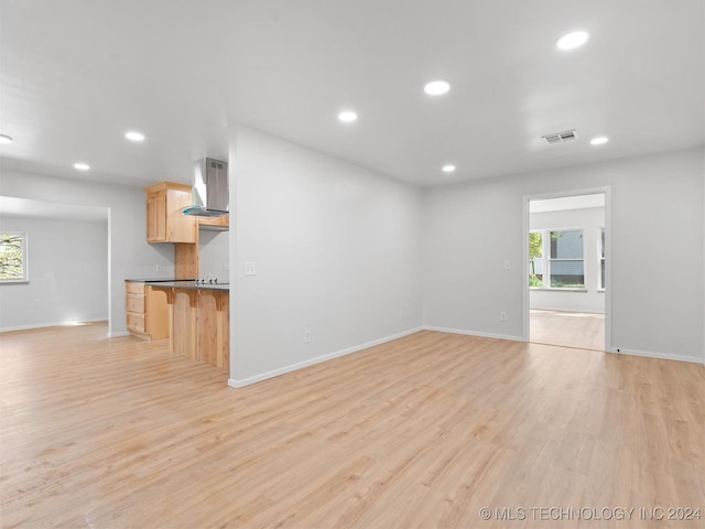 unfurnished living room with light wood-type flooring