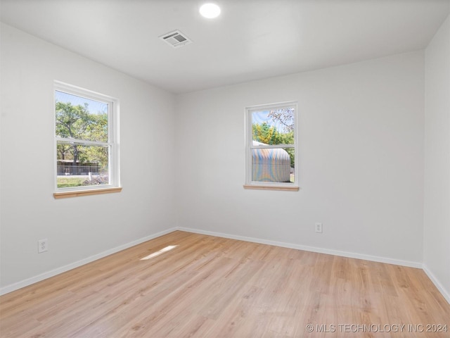 empty room with light hardwood / wood-style floors