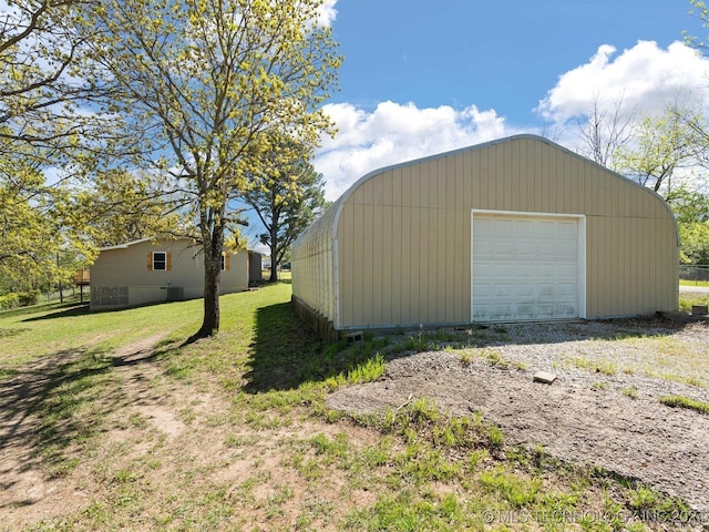 garage featuring a lawn