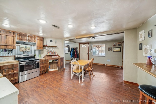 kitchen with dark hardwood / wood-style floors and electric stove