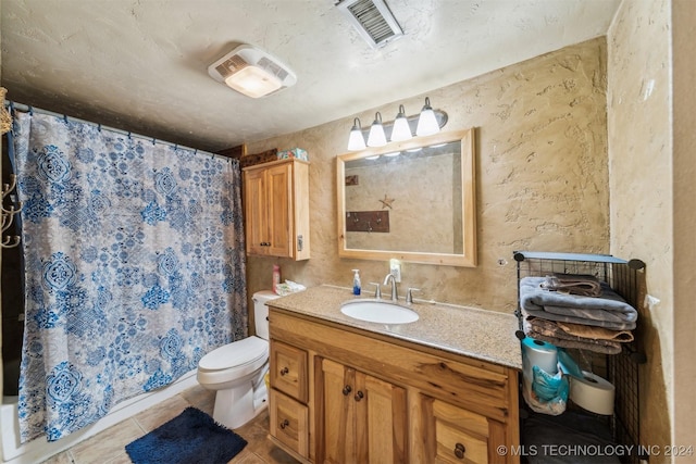 bathroom with tile patterned floors, vanity, toilet, and a shower with shower curtain