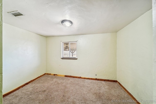 unfurnished room with carpet floors