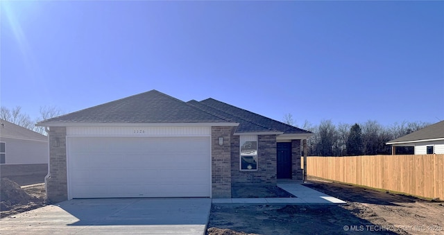 view of front of property with a garage