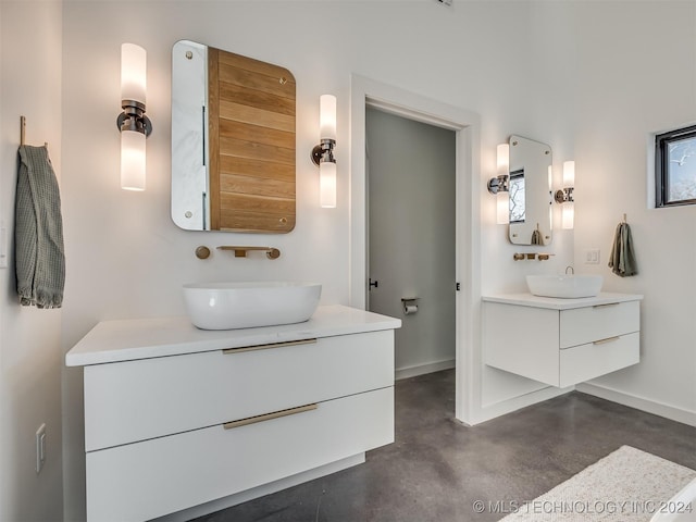 bathroom with concrete flooring and vanity