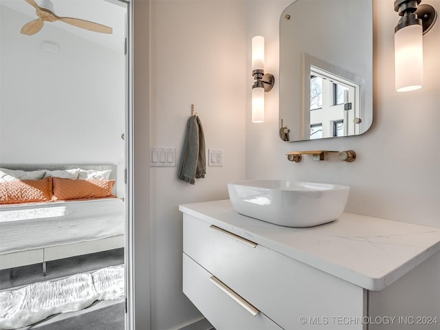 bathroom featuring ceiling fan and vanity