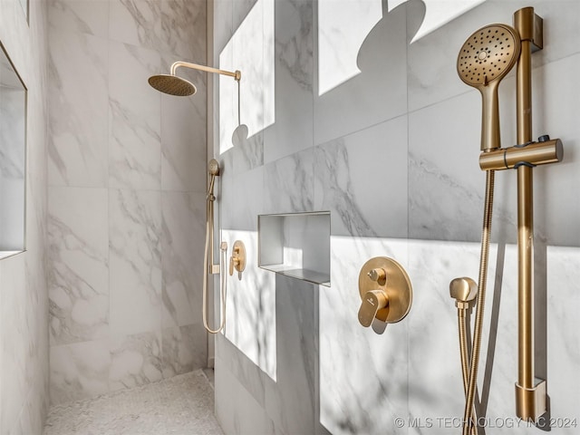 interior space featuring tiled shower