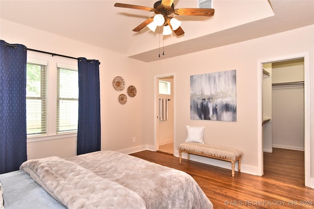 bedroom featuring ceiling fan, dark hardwood / wood-style flooring, and lofted ceiling