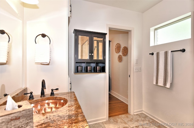 bathroom featuring tile patterned flooring and vanity