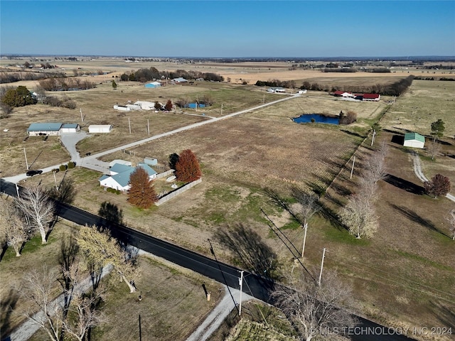 birds eye view of property featuring a rural view