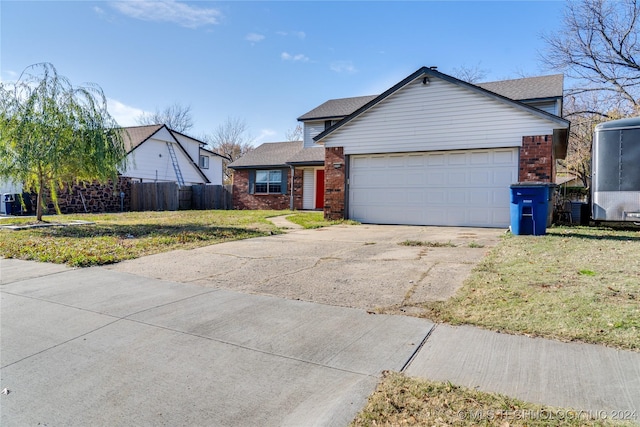 view of front facade featuring a garage and a front lawn