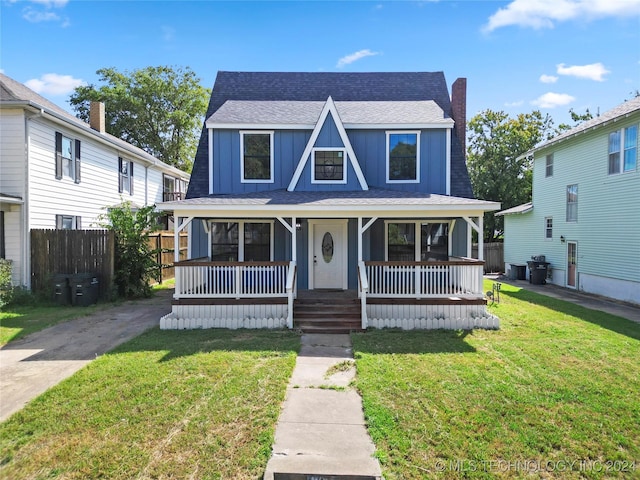 view of front facade with a front lawn and a porch