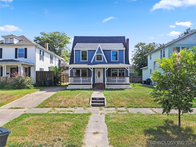 view of front of house with a porch and a front yard