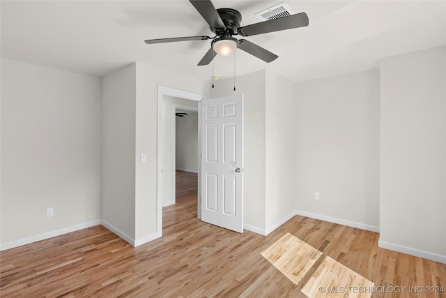 unfurnished room with ceiling fan and light hardwood / wood-style flooring