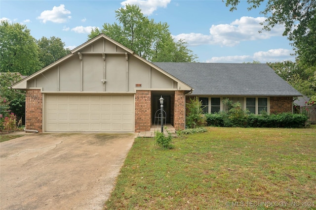 ranch-style house featuring a garage and a front yard