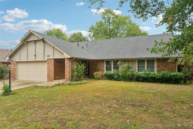 ranch-style house with a front yard and a garage