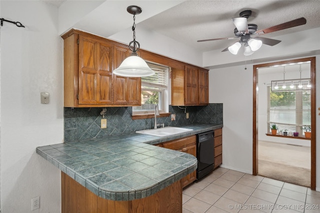 kitchen with ceiling fan, dishwasher, sink, backsplash, and light tile patterned floors