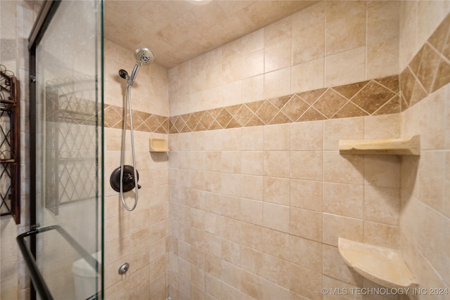 bathroom featuring an enclosed shower