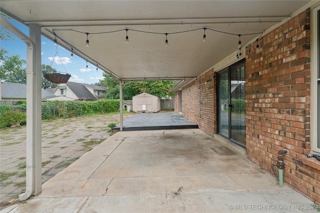 view of patio / terrace featuring a storage unit