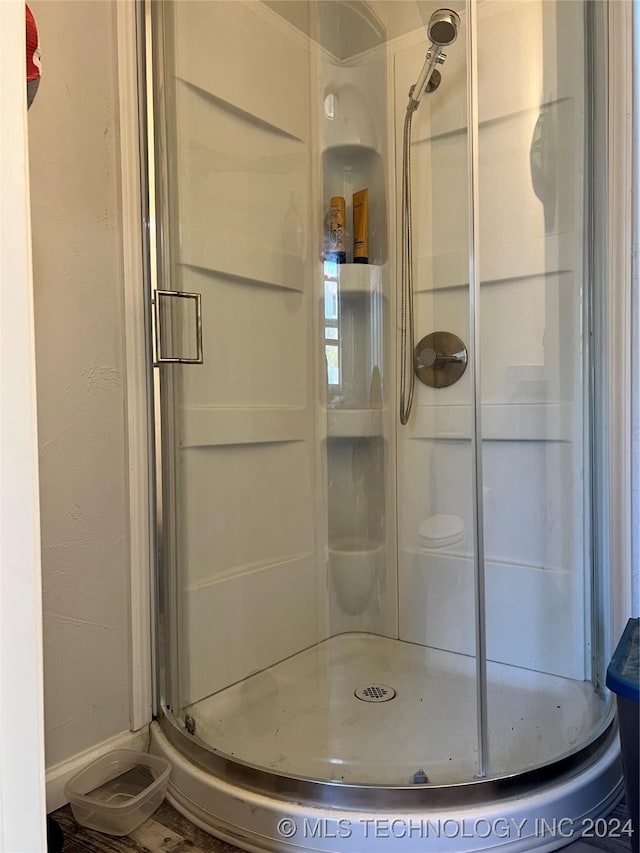 bathroom featuring an enclosed shower